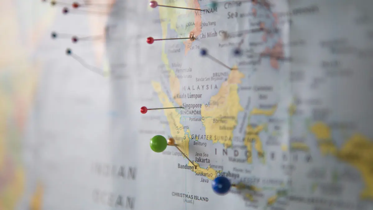World map with pins marking international teaching destinations